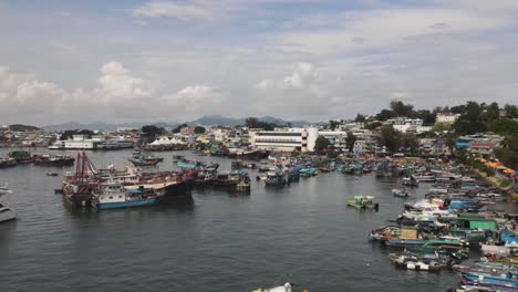 Aerial-View-Of-Fishing-Boats-Moored-At-Marina-At-Cheung-Chau-Island-In-Hong-Kong-City