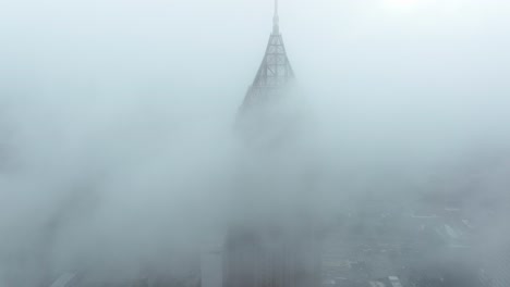 Iconic-skyscraper-Bank-of-America-Plaza-appears-through-the-clouds,-Atlanta,-Georgia,-USA