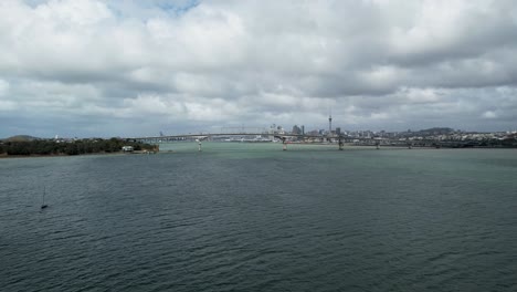 Auckland-Harbour-Bridge-and-Views-of-Downtown-over-Waitemata-Harbour-with-an-Aerial-Drone-Dolly-Out-Shot-in-New-Zealand