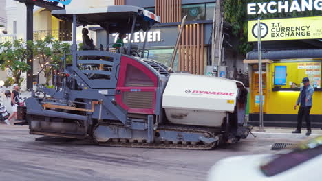 Asphalt-spreader-or-an-asphalt-paver-machine-on-a-road-construction-site
