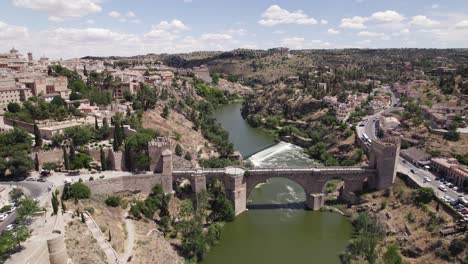 St-Martin's-medieval-bridge-in-Toledo-Spain-spanning-Tagus-river,-aerial-view