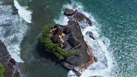 Top-Down-View-Of-Tanah-Lot-Temple-In-Scenic-Ocean-Of-Bali,-Indonesia---drone-shot