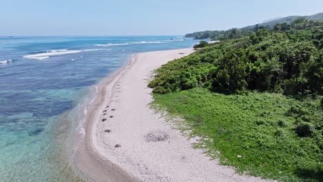 Drone-flying-over-wild-and-deserted-beach-of-El-Quemaito-beach,-Barahona-in-Dominican-Republic