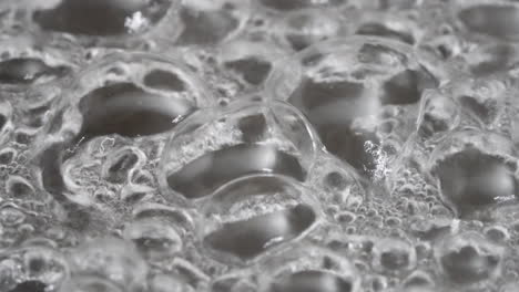 Boiling,-bubbling-water---isolated-macro