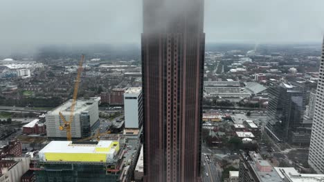 Aerial-view-of-supertall-skyscraper-Bank-of-America-Plaza-exterior,-Peachtree-street-traffic