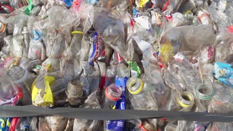 Top-view-of-a-bale-of-compacted-plastic-bottles-ready-for-recycling-at-a-waste-processing-facility