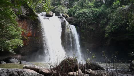 Cascading-Heo-Suwat-Waterfall-pouring-down-pecious-water-for-the-rainforest,-Thailand