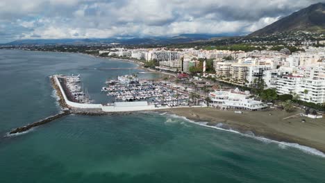 Marbella-Coastline-with-Port,-Boulevard-and-Hotels-in-Andalusia,-Spain---Aerial