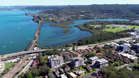 Drone-aerial-landscape-view-Gosford-harbour-waterfront-buildings-train-line-river-Brisbane-Water-inlet-Narara-Creek-travel-tourism-Central-Coast-NSW-Australia