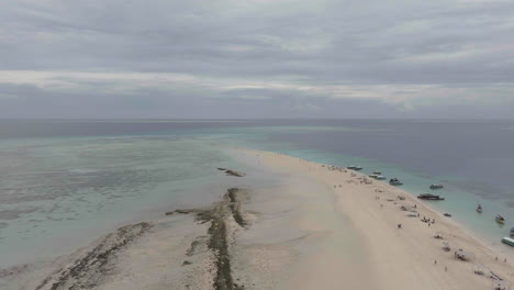 Aerial-view-of-beautiful-Nakupenda-island-with-white-sand-beach,-boats-and-tourists,-Zanzibar,-Tanzania