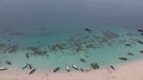 Aerial-view-of-beautiful-Nakupenda-island-with-white-sand-beach,-boats-and-tourists,-Zanzibar,-Tanzania
