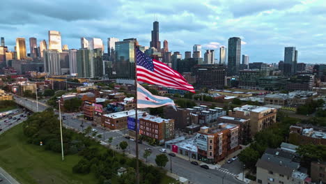 Aerial-view-of-flags-and-traffic-on-the-West-Grand-Avenue,-sunrise-in-Chicago