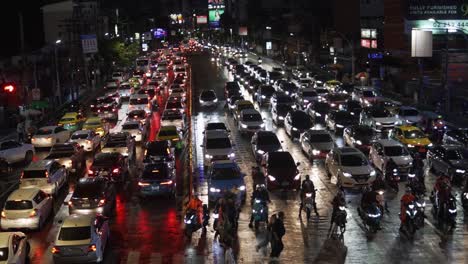 People-Walking-Across-The-Busy-Asoke-Montri-Crosswalk-In-Downtown-Bangkok-