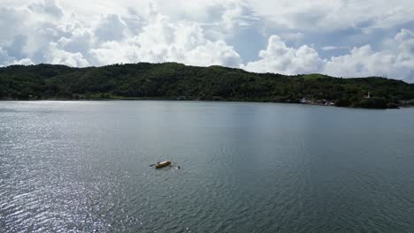 Breathtaking-view-of-traditional-Philippine-bangka-boat-floating-in-the-tranquil-bay-of-Baras,-Catanduanes