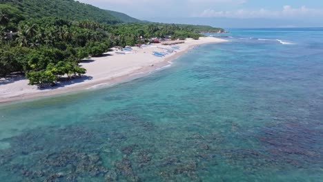Flying-Over-Crystal-Clear-Water-Towards-Quemaito-Beach-In-Summer-In-Barahona,-Dominican-Republic