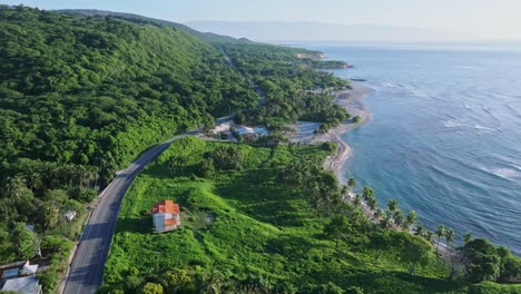 Tropical-sunrise-coastline-in-Caribbean-countryside-with-remote-houses-on-road