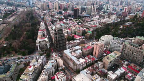 Flyover-of-the-Lastarria-and-Bellas-Artes-neighborhoods-with-the-Santa-Lucia-hill-and-the-Forestal-Park,-Santiago-Chile