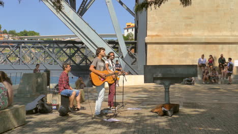 Male-Band-Busking-In-Front-Of-People-In-The-Vilanova-de-Gaia-In-Porto,-Portugal