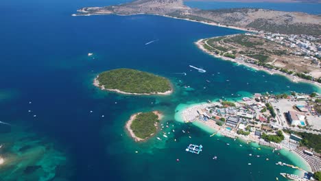Islands-of-Ksamil-Coastal-Beauty:-Azure-Seas,-Expansive-White-Sand-Beaches,-Hotels,-Resorts,-and-the-Perfect-Summer-Vacation-Getaway