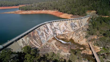 Aerial-view-over-Wellington-Dam-mural,-Collie,-Western-Australia---orbit,-drone-shot