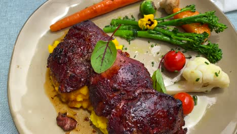 Delicious-tender-beef-cheecks-with-creamy-polenta-and-vegetables,-fancy-restaurant-dining-experience,-soft-meat,-4K-shot