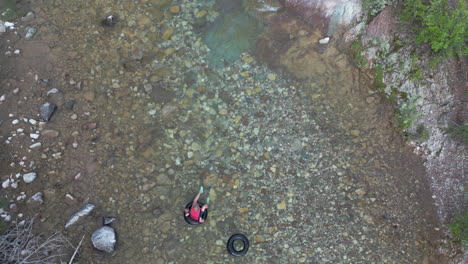 Inner-Tube-Rider-Tries-to-Save-Empty-Inner-Tube-from-Floating-too-Far-Down-the-River