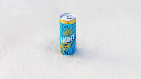 This-is-a-static-video-of-a-can-of-Kalik-Light-beer-on-a-beach-shoreline
