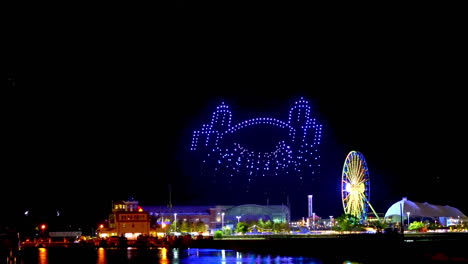Drone-light-show-at-the-Navy-pier-illustrating-the-skyscrapers,-river-and-bridges-of-Chicago