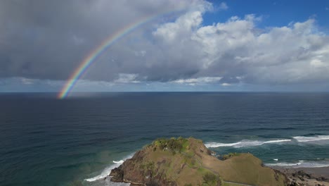 Rainbow-And-Scenic-Seascape-In-Norries-Headland,-NSW,-Australia---aerial-drone-shot
