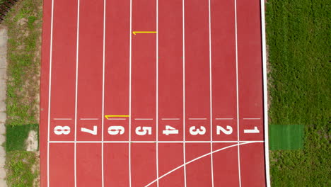 Top-down-aerial-over-the-track-and-numbered-starting-blocks-at-the-finish-line