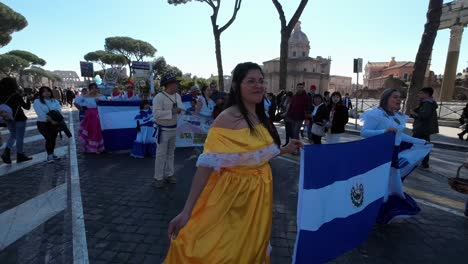 El-Salvador-community-parading-during-a-Latin-American-carnival-in-Rome,-capital-of-Italy