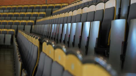 Orbiting-close-up-of-empty-seats-at-hockey-arena