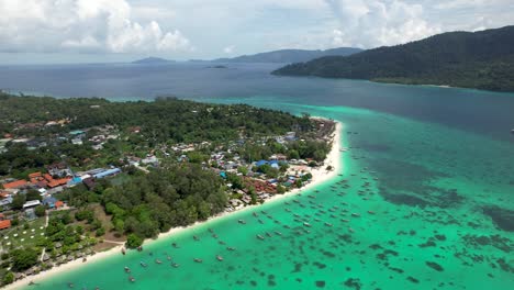 Koh-Lipe-Island-Thailand-Coastline-with-turquoise-water-beaches-and-long-tail-boats--aerial-perspective