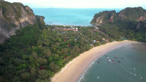Aerial-view-of-Buildings-at-Railay-beach-Krabi-Thailand-with-sandy-beach-and-boats