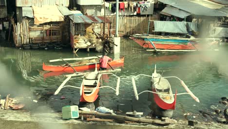 A-fisherman-arrives-at-his-home-with-other-boats-and-floating-villages