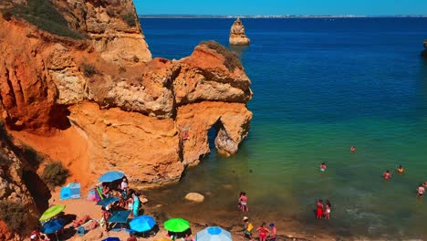 Discovering-the-rock-formations-at-Praia-do-Camilo,-Algarve,-Lagos,-Portugal