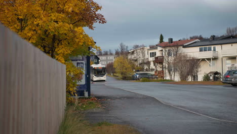 Public-Transportation-With-Passenger-Getting-Off-The-Bus-At-The-Station-In-Tromso,-Norway