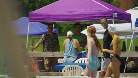 People-And-Tents-At-The-Summer-Swimming-Competition-In-Siloam-Springs,-Arkansas,-United-States