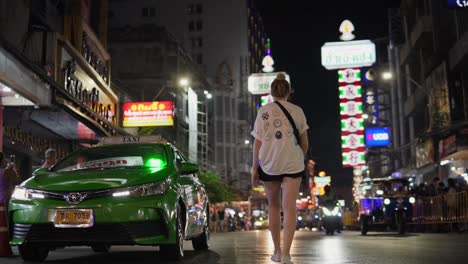 Female-Traveler-Exploring-Bangkok's-Chinatown-Night-Scene-Walking-Down-The-Famous-Yaowarat-Road