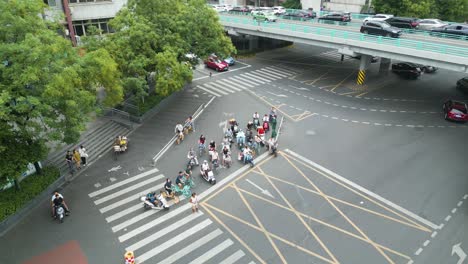 Aerial-Gaze-Upon-City-Commuters-Awaiting-Their-Turn-to-Cross-The-Road,-Pedestrians-Waiting-to-cross-the-Road