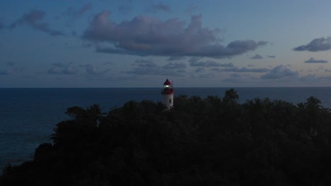 Cape-Three-Points-Lighthouse-Ghana-West-Africa-Aerial-Footage-after-Sunset