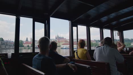 People-in-River-Cruise-Boat-Enjoy-the-View-of-the-Historic-City-Prague