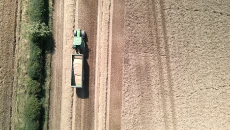 Aerial-footage-of-a-tractor-harvesting-a-wheat-crop