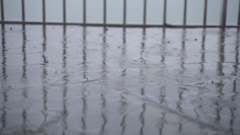 4K-30FPS-Slowmotion-View-of-Rain-Falling-on-Flagstones,-Heavy-Rain