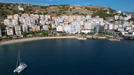 Saranda-Coastal-Cityscape,-Beautiful-Harbor,-Beachfront-Hotels,-Boats-in-the-Bay---Your-Ideal-Destination-for-a-Summer-Holiday