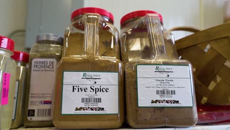Close-shot-of-Five-Spice-and-Masala-Garam-with-commercial-packaging-of-plastic-bottles-and-red-cap,-USA
