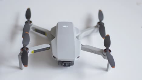The-DJI-Mini-2-rests-on-a-table-as-the-camera-focuses-from-rear-to-front