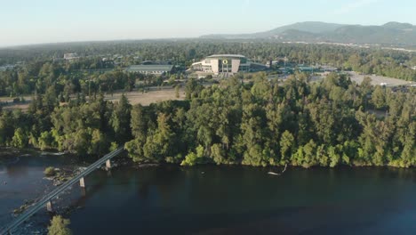 A-drone-establishing-shot-of-Willamette-River-and-the-Autzen-Stadium-on-the-University-of-Eugene-campus