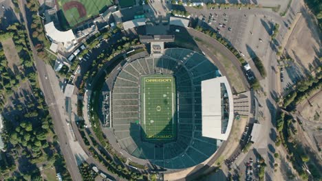 High-altitude-satellite-drone-shot-of-Autzen-Stadium-and-surrounding-Eugene,-Oregon