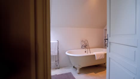 Interiors-of-modern-bathroom-with-windows-and-toilet-inside-lavish-mansion